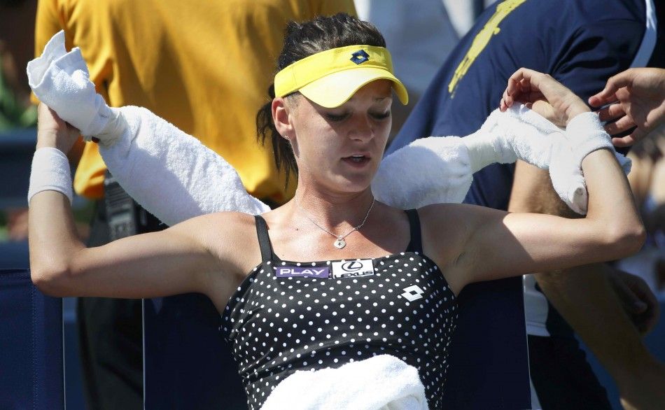 Agnieszka Radwanska of Poland uses ice bags wrapped in towels to keep cool during her match against Peng Shuai of China at the 2014 U.S. Open tennis tournament in New York, August 27, 2014. REUTERSMike Segar 