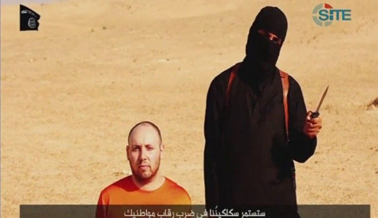 Still image from video of Sotloff kneeling next to a masked Islamic State fighter