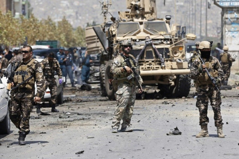 NATO troops arrive at the site of a suicide car bomb attack in Kabul