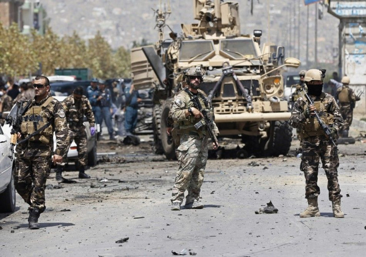 NATO troops arrive at the site of a suicide car bomb attack in Kabul