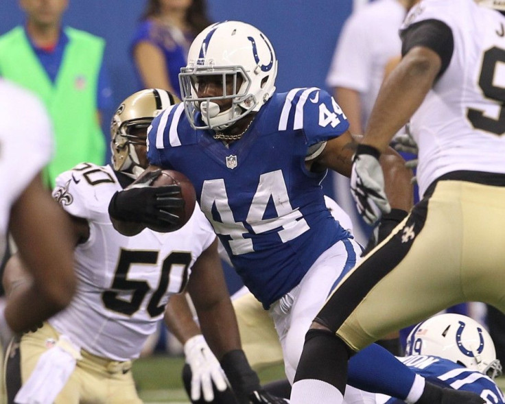 Aug 23, 2014; Indianapolis, IN, USA; Indianapolis Colts running back Ahmad Bradshaw (44) runs the ball during the second quarter against the New Orleans Saints at Lucas Oil Stadium.