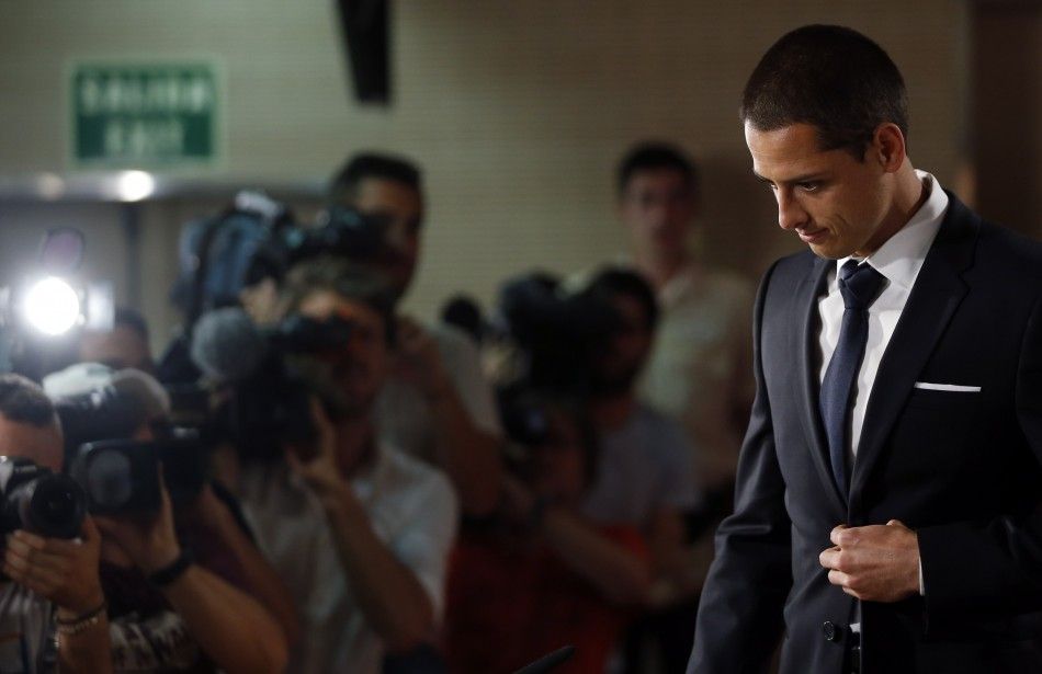 Real Madrids new player Javier Hernandez arrives for a news conference at Santiago Bernabeu stadium in Madrid September 1, 2014. Real Madrid have moved to broaden their options in attack by agreeing to sign Mexico striker Hernandez, known as quotChicha