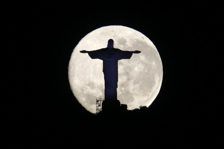 The Supermoon Is Pictured Behind The Christ The Redeemer Statue In Rio de Janeiro