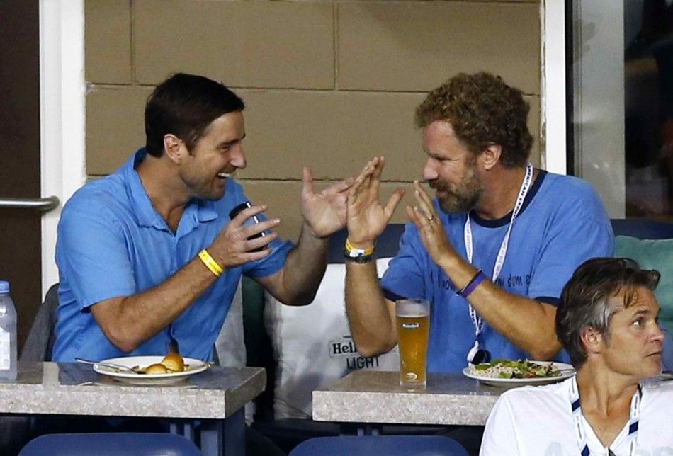 Actors Will Ferrell R and Luke Wilson chat as they attend the mens singles match between Roger Federer of Switzerland and Marcel Granollers of Spain during the 2014 U.S. Open tennis tournament in New York, August 31, 2014. REUTERSAdam Hunger