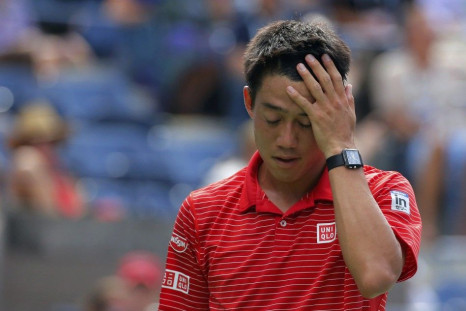 Kei Nishikori of Japan wipes his face