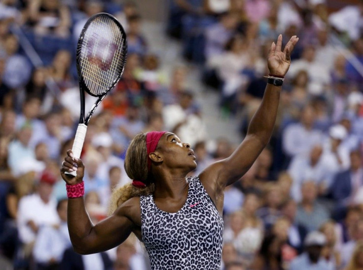 Serena Williams of the U.S. serves to Flavia Pennetta of Italy in their quarter-final women&#039;s singles match at the 2014 U.S. Open tennis tournament in New York, September 3, 2014.