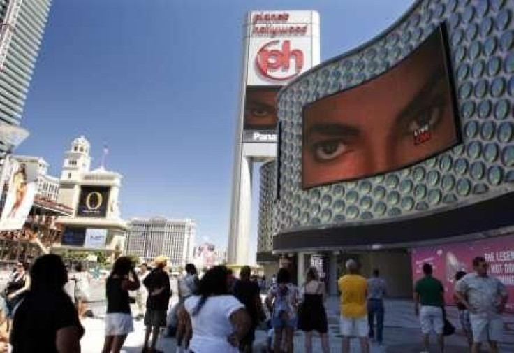 People watch live television news coverage of the Michael Jackson memorial in Las Vegas