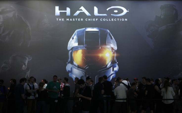 Vistors Wait At The 'Halo: The Master Chief Collection' Exhibition Stand During The Gamescom 2014 Fair.