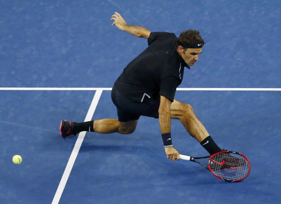 Roger Federer of Switzerland come to the net