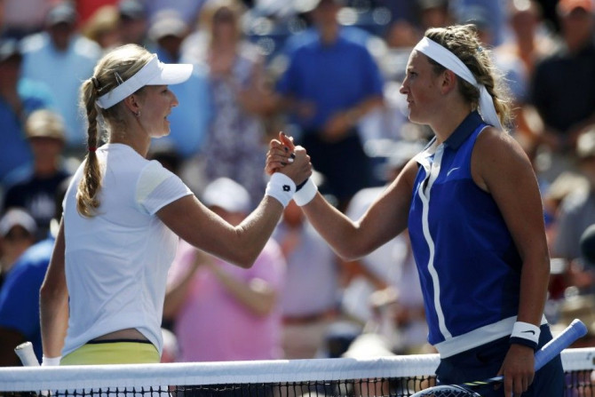 Victoria Azarenka of Belarus congratulates winner Ekaterina Makarova of Russia after their quarter-final match at the 2014 U.S. Open tennis tournament in New York, September 3, 2014.