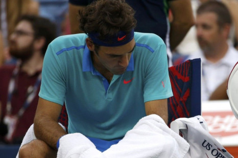 Roger Federer of Switzerland reacts during a break