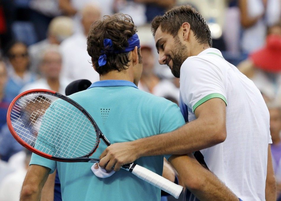 Marin Cilic of Croatia R and Roger Federer of Switzerland