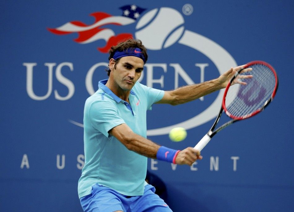 Roger Federer of Switzerland hits a return 