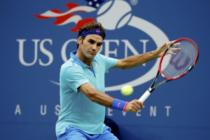 Roger Federer of Switzerland hits a return 