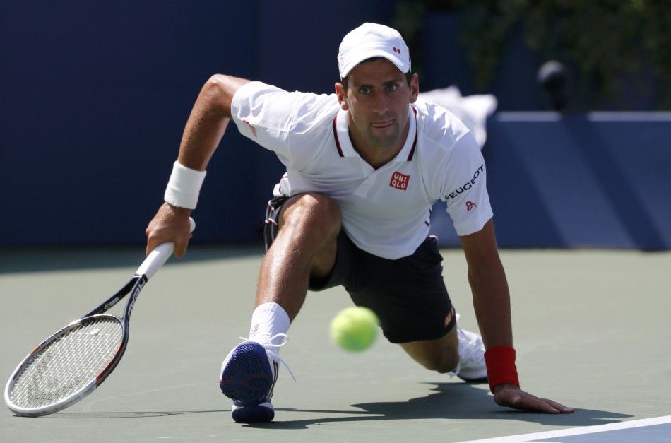 Novak Djokovic of Serbia slips
