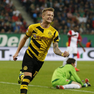 Borussia Dortmund&#039;s Marco Reus celebrates a goal against Augsburg during the German Bundesliga first division soccer match in Augsburg August 29, 2014.