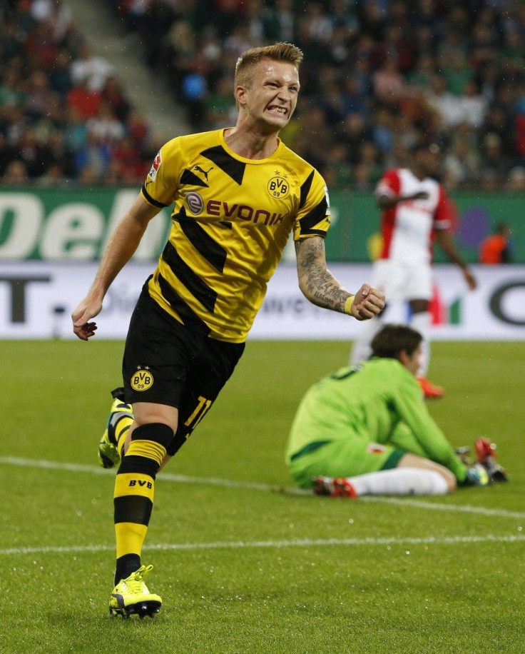 Borussia Dortmund&#039;s Marco Reus celebrates a goal against Augsburg during the German Bundesliga first division soccer match in Augsburg August 29, 2014.