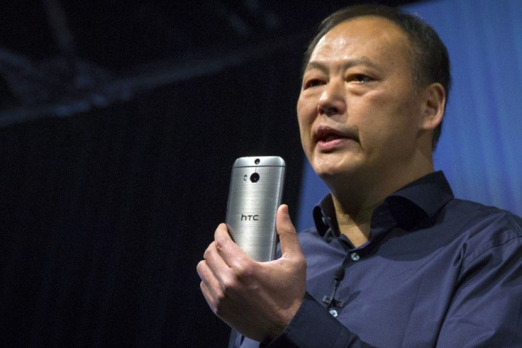 HTC CEO Peter Chou shows the new HTC One M8 phone