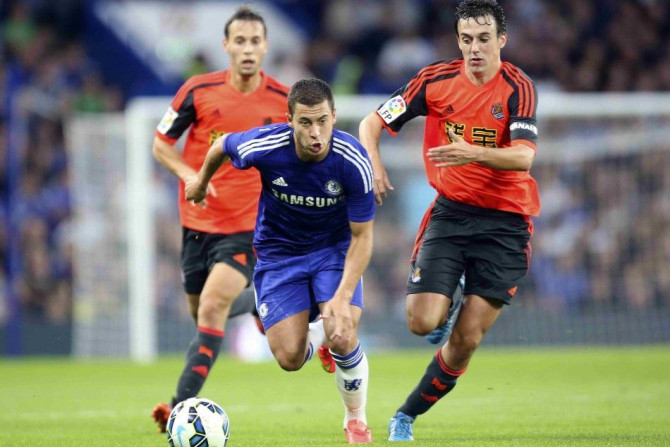 Chelsea's Eden Hazard (C) runs with the ball during their friendly soccer match against Real Sociedad at Stamford Bridge in London, August 12, 2014.
