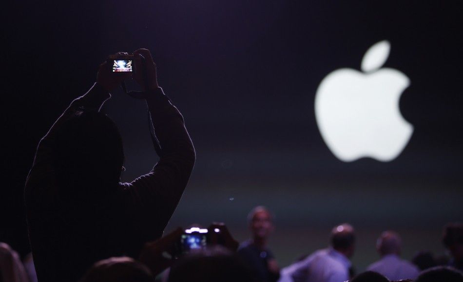 An audience member takes a photo before the Apple event announcing the iPhone 6 and the Apple Watch at the Flint Center in Cupertino