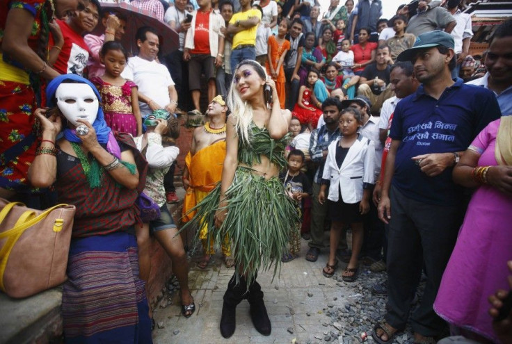 A reveller dances while taking part in LGBT pride parade to mark Gaijatra Festival, also known as the festival of cows, in Kathmandu