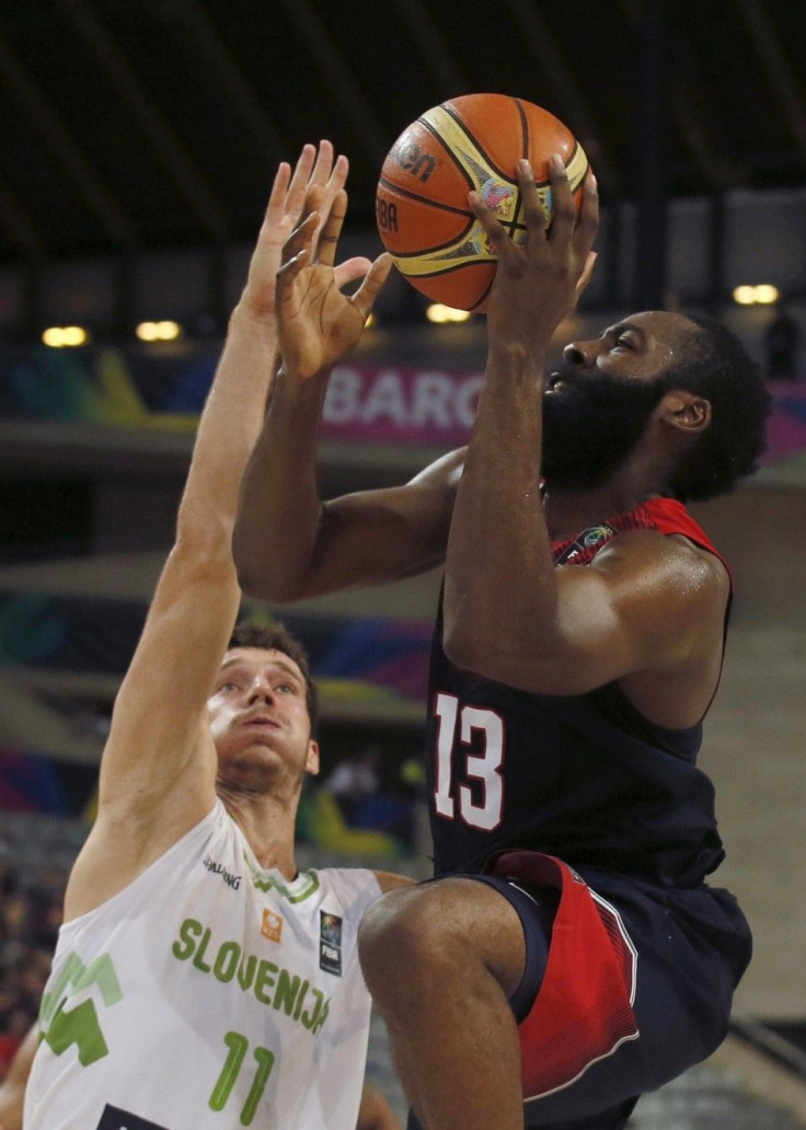 James Harden of the U.S. (R) goes up for a basket over Slovenia&#039;s Goran Dragic during their Basketball World Cup quarter-final game in Barcelona September 9, 2014.