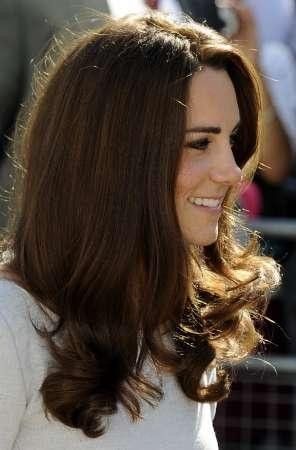 Britains Catherine, Duchess of Cambridge, smiles as she arrives for a visit to the Royal Marsden hospital in Sutton