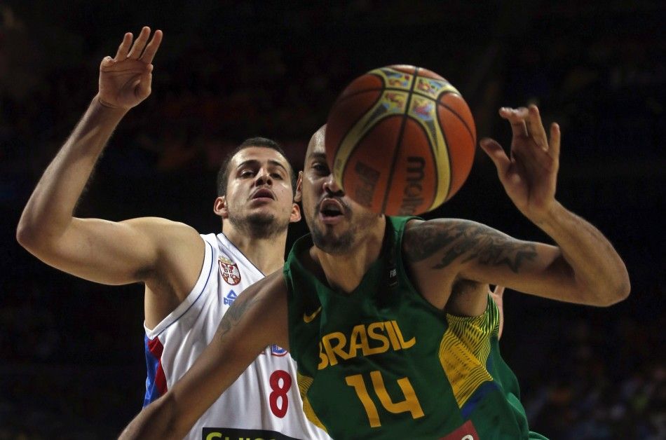 Brazils Marquinhos Vieira R and Serbias Nemanja Bjelica fight for the ball 