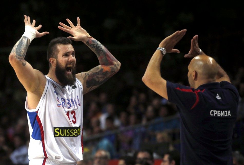 Serbias Miroslav Raduljica L celebrates with coach Sasha Djordjevic