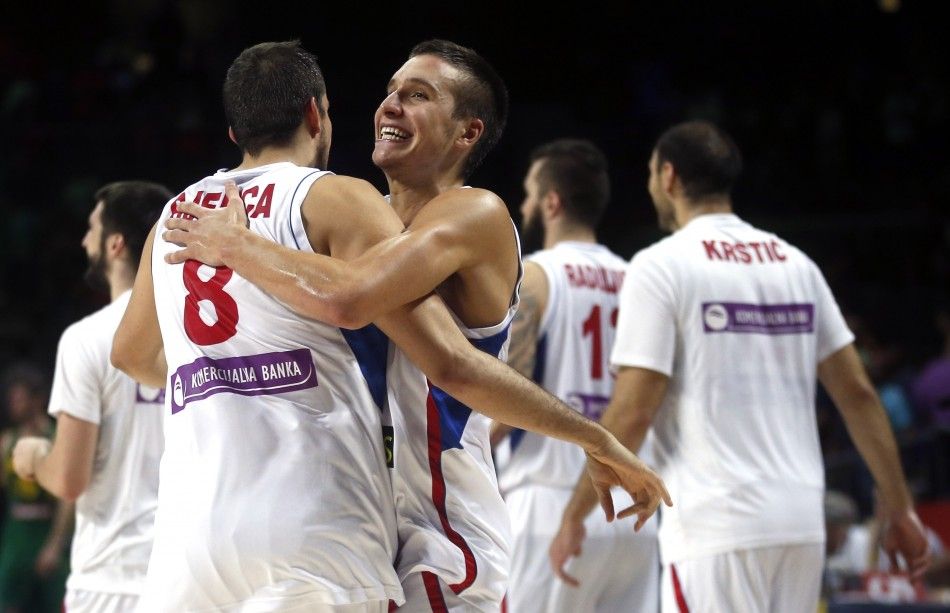 Serbias Bogdan Bogdanovic R celebrates with team mate Nemanja Bjelica