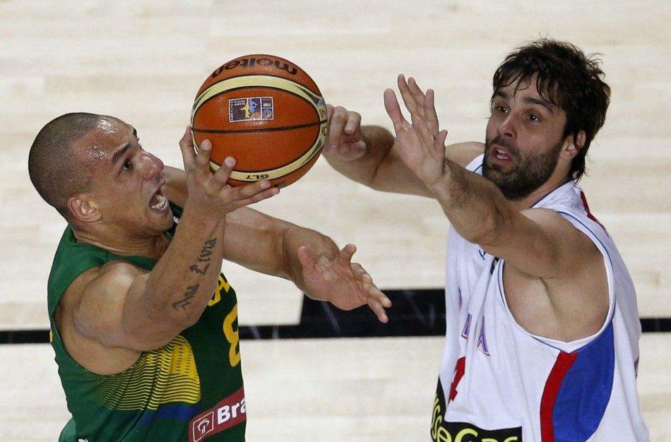 Brazils Alex Garcia L challenges Serbias Milos Teodosic 