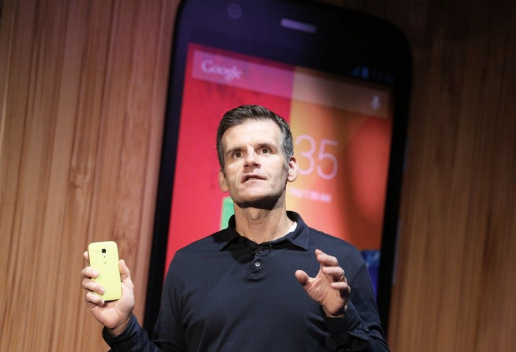 Motorola Mobility CEO Dennis Woodside holds a new Moto G mobile phone