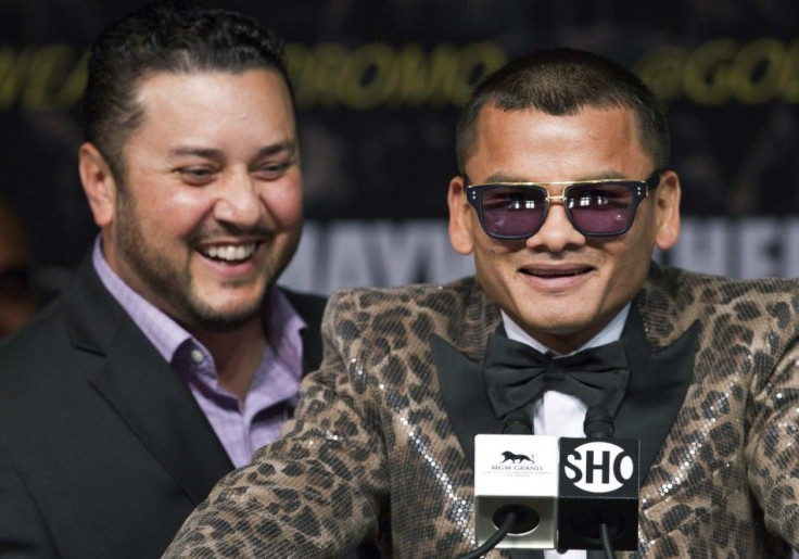 Marcos Maidana (R) of Argentina speaks during a news conference