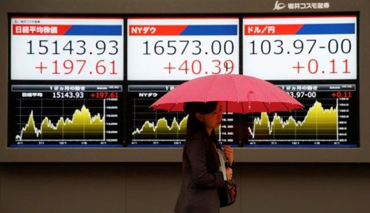 Japan tech shares slip; others relieved at U.S. jobs