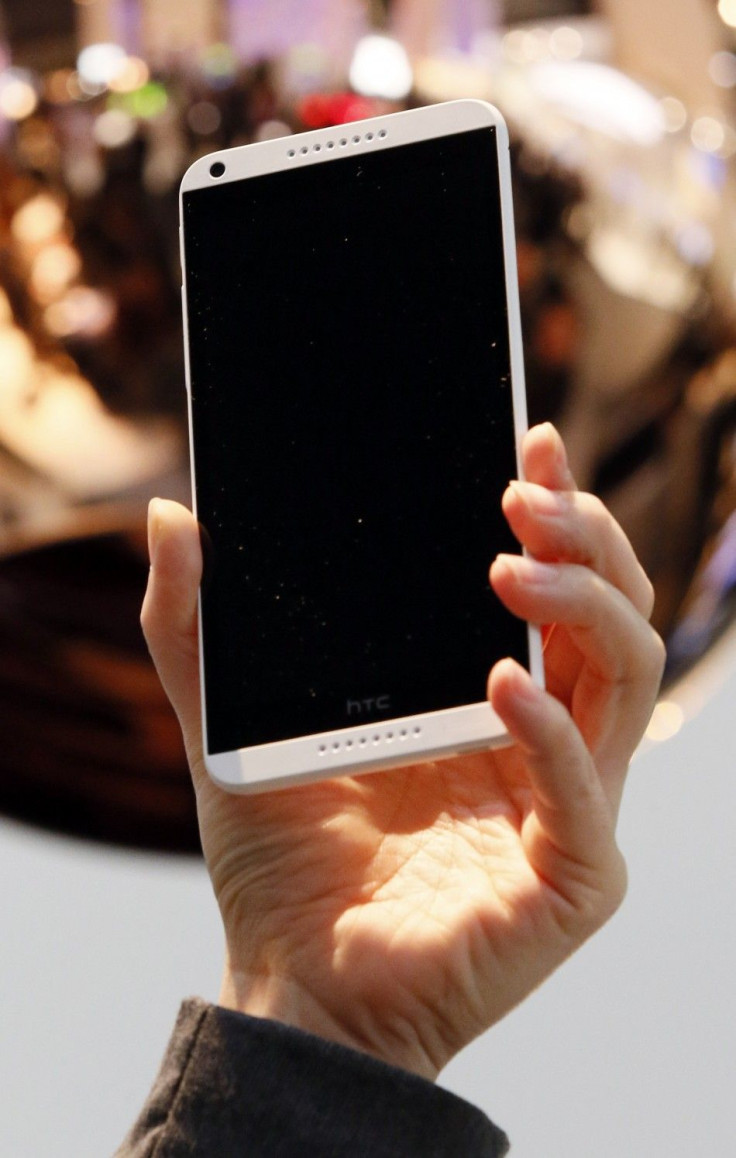 A model holds up the HTC Desire 816 at the Mobile World Congress in Barcelona 