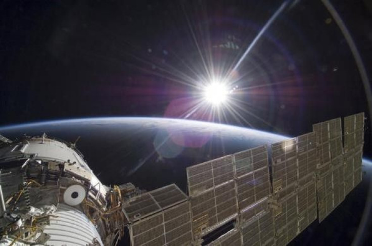 The bright sun greets the ISS in this photo taken from the Russian section of the orbital outpost by one of the STS-129 crew members November 22, 2009.