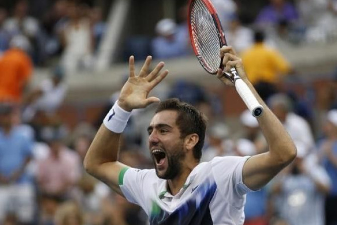 Marin Cilic of Croatia celebrates after defeating Roger Federer of Switzerland in their semi-final match at the 2014 U.S. Open tennis tournament in New York, September 6, 2014.