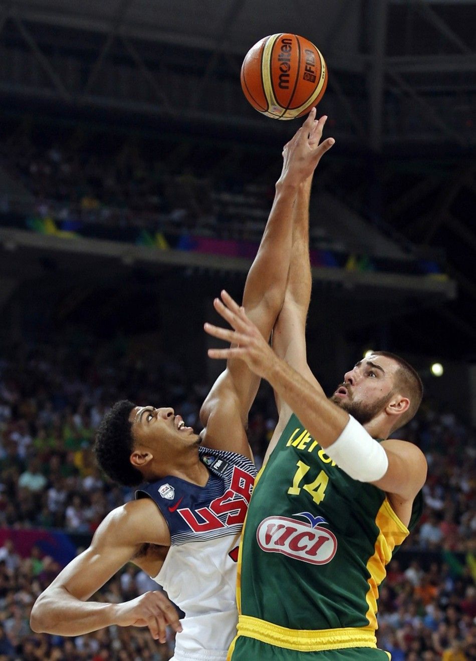 Jonas Valanciunas R of Lithuania goes up for a basket over Anthony Davis of the U.S. 