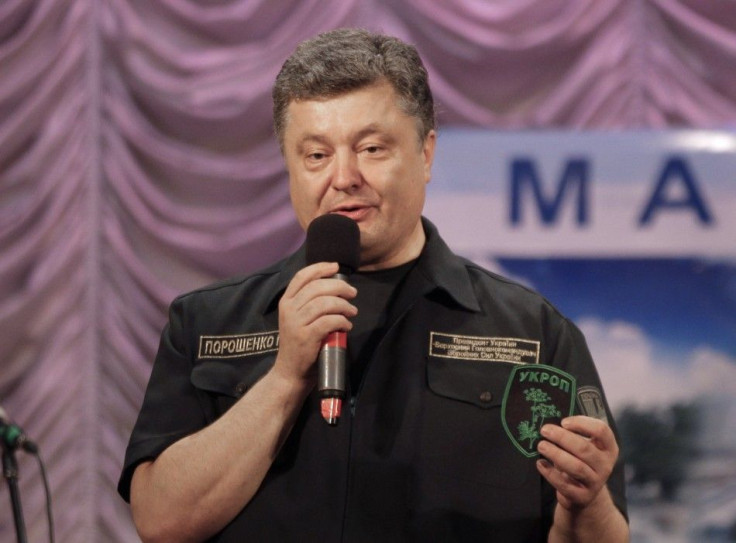 Ukrainian President Poroshenko speaks during his meeting with people in the southern coastal town of Mariupol