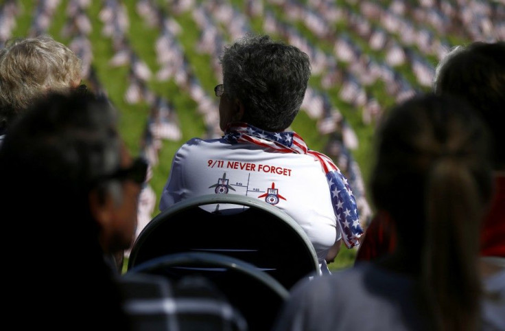 A Women Looks Out Over Some Of The 2,977 Flags Laid Out To Signify The People Who Lost Their Lives In The 9/11 Attacks In New York, Washington, D.C., And Shanksville, Pennsylvania, During A Remembrance Event On The Campus Of Cuyamaca College In El Cajon, 