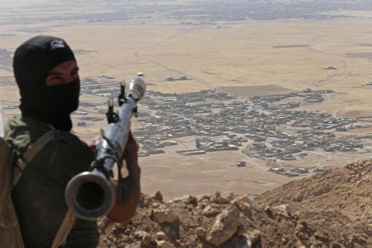 A Kurdish Peshmerga Fighter Holds A Rocket-Propelled Grenade Launcher