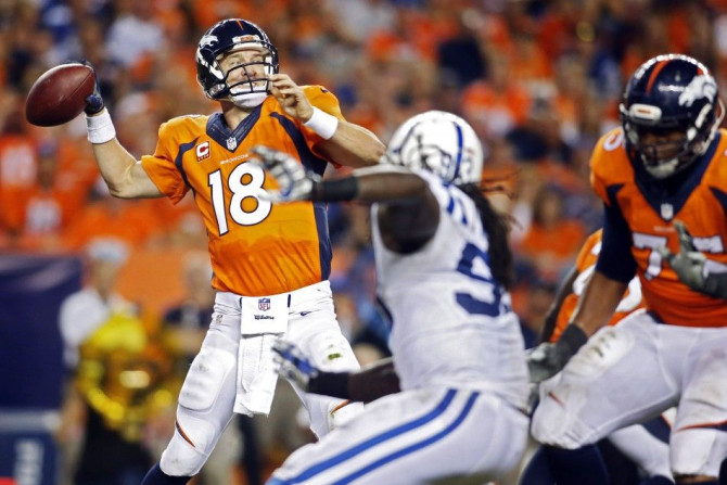 Denver Broncos quarterback Peyton Manning (18) passes the ball during the second half against the against the Indianapolis Colts
