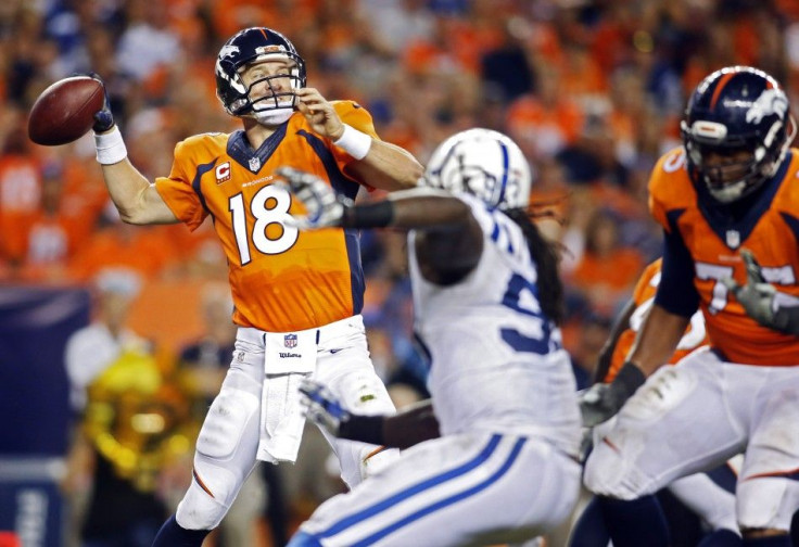 Denver Broncos quarterback Peyton Manning (18) passes the ball during the second half against the against the Indianapolis Colts