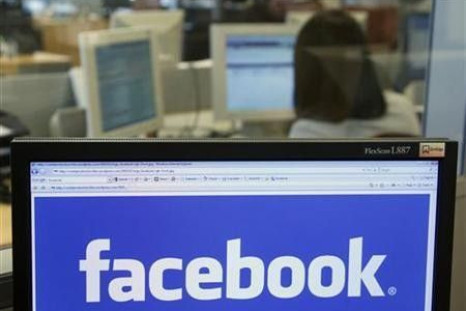 The Facebook logo is displayed on a computer screen in Brussels,