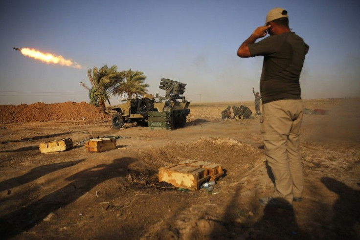 Shi'ite fighters from Mahde Army launch rockets during heavy fighting against Islamic state members
