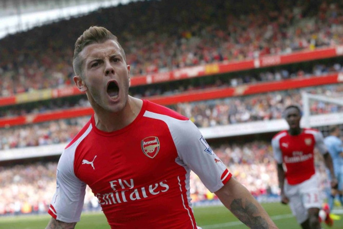 Arsenal's Jack Wilshere celebrates after scoring a goal against Manchester City during their English Premier League soccer match at the Emirates stadium in London September 13, 2014.