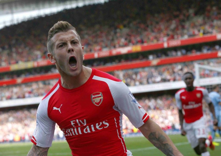 Arsenal's Jack Wilshere celebrates after scoring a goal against Manchester City during their English Premier League soccer match at the Emirates stadium in London September 13, 2014.
