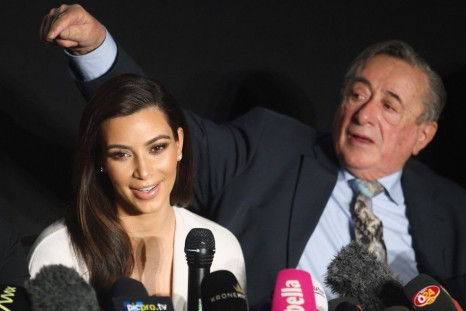 U.S. television personality Kim Kardashian (L) and her host Viennese millionaire mall developer Richard Lugner attend a news conference ahead of the Opera Ball in Vienna February 27, 2014.