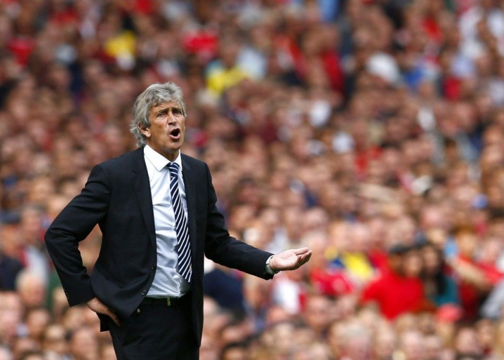 Manchester City&#039;s manager Manuel Pellegrini reacts during their English Premier League soccer match against Arsenal at the Emirates stadium in London September 13, 2014.