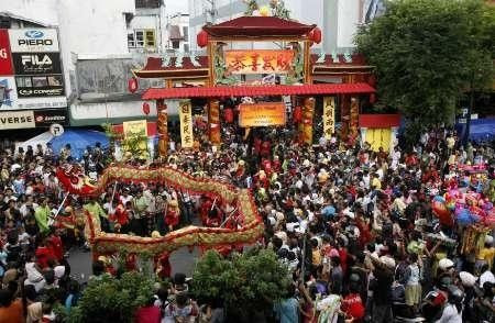 Residents watch a dragon dance